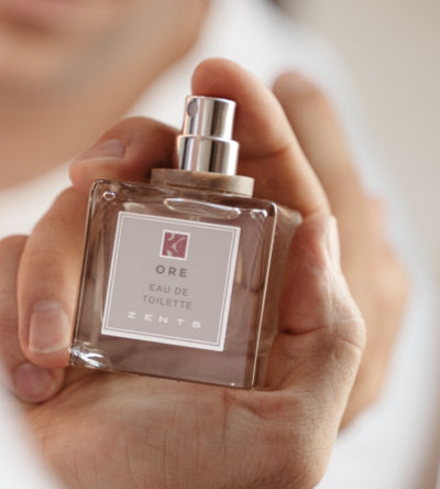 Closeup of Ore Eau de Toilette in man's hand